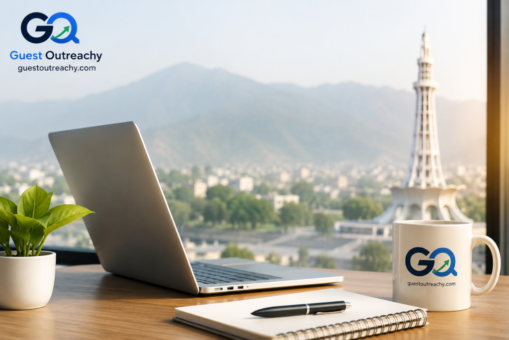 Modern SEO workspace featuring a laptop, notebook, branded Guest Outreachy coffee mug, and office desk with Minar-e-Pakistan in the background, representing professional SEO services and digital marketing in Pakistan.